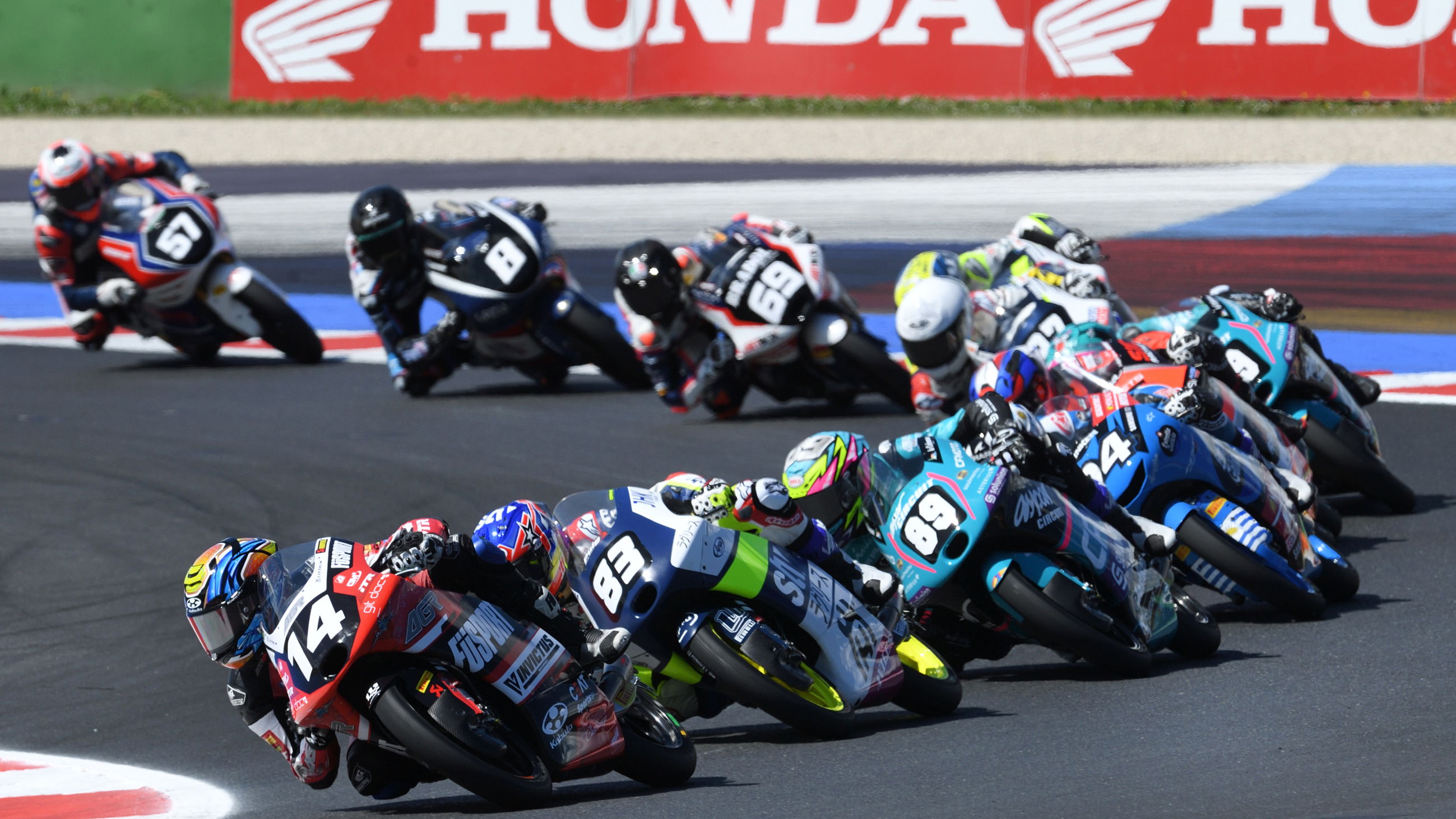 Cormac Buchanan (#14) leads Moto3 group, 2024 Emilia-Romagna JuniorGP. Credit: JuniorGP.